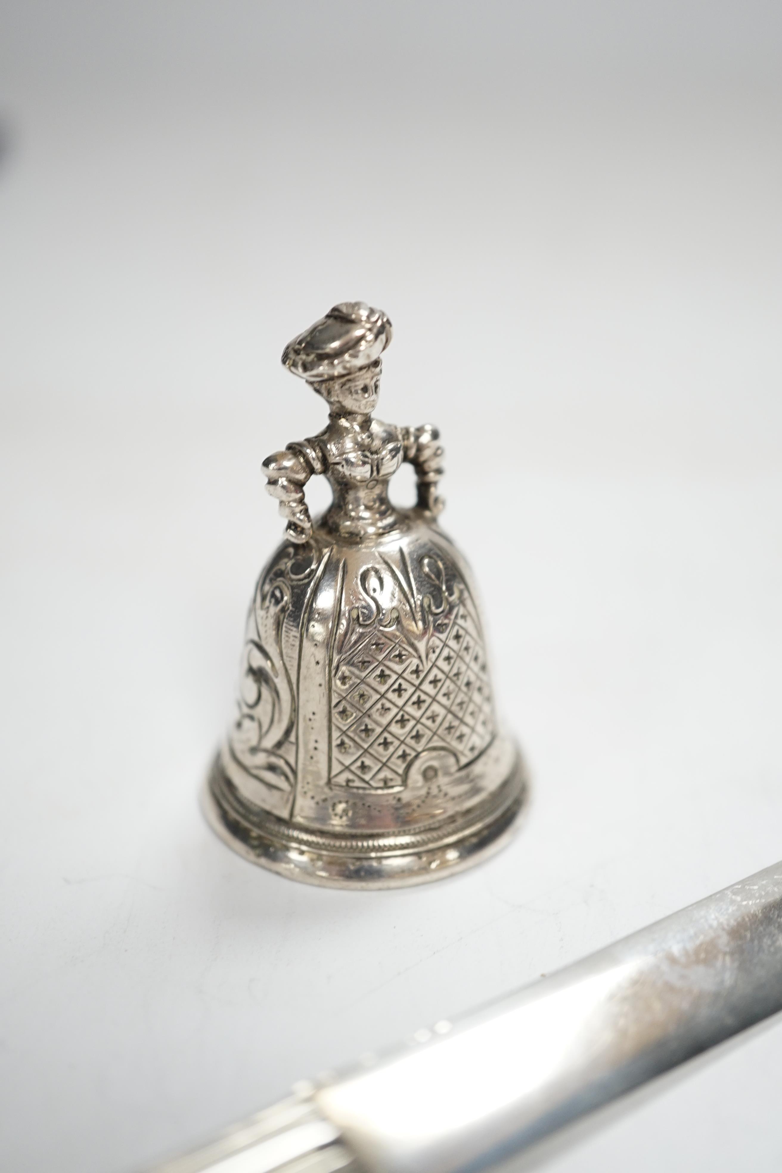 An early 20th century Hanau? miniature figural table bell, 46mm, a late Victorian silver combination paper knife and pencil, Arthur Downing Ltd?, Birmingham, 1897 and a late Victorian silver and Scottish hardstone set ri
